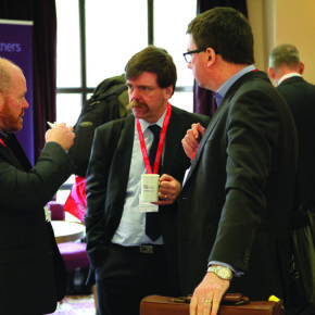 People discussing at the 2015 Housing Technology Conference