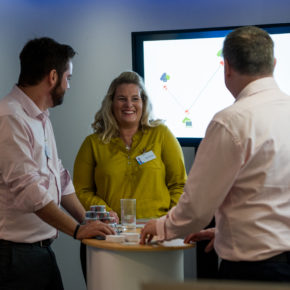 discussion at a sponsor stand at connected communities 2019