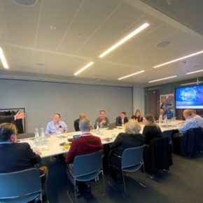 George Grant and guests sitting around table at Strategy Forum in London