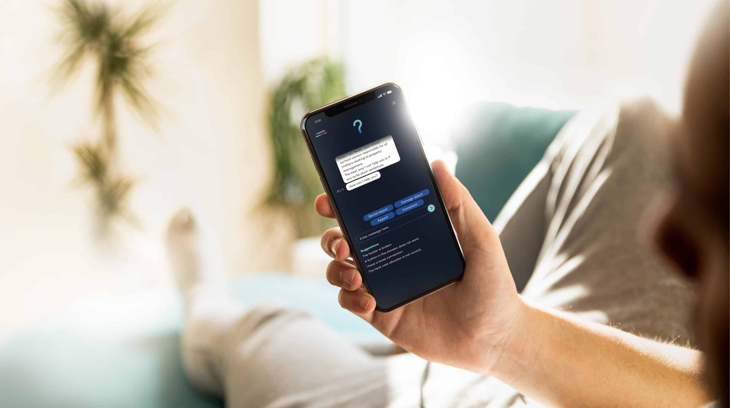 Person using Aareon's virtual assistant Neela on their mobile phone