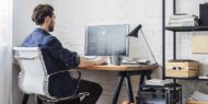 Man sitting at desk on computer