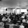 person presenting at housing technology conference