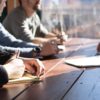 People around a table having a meeting